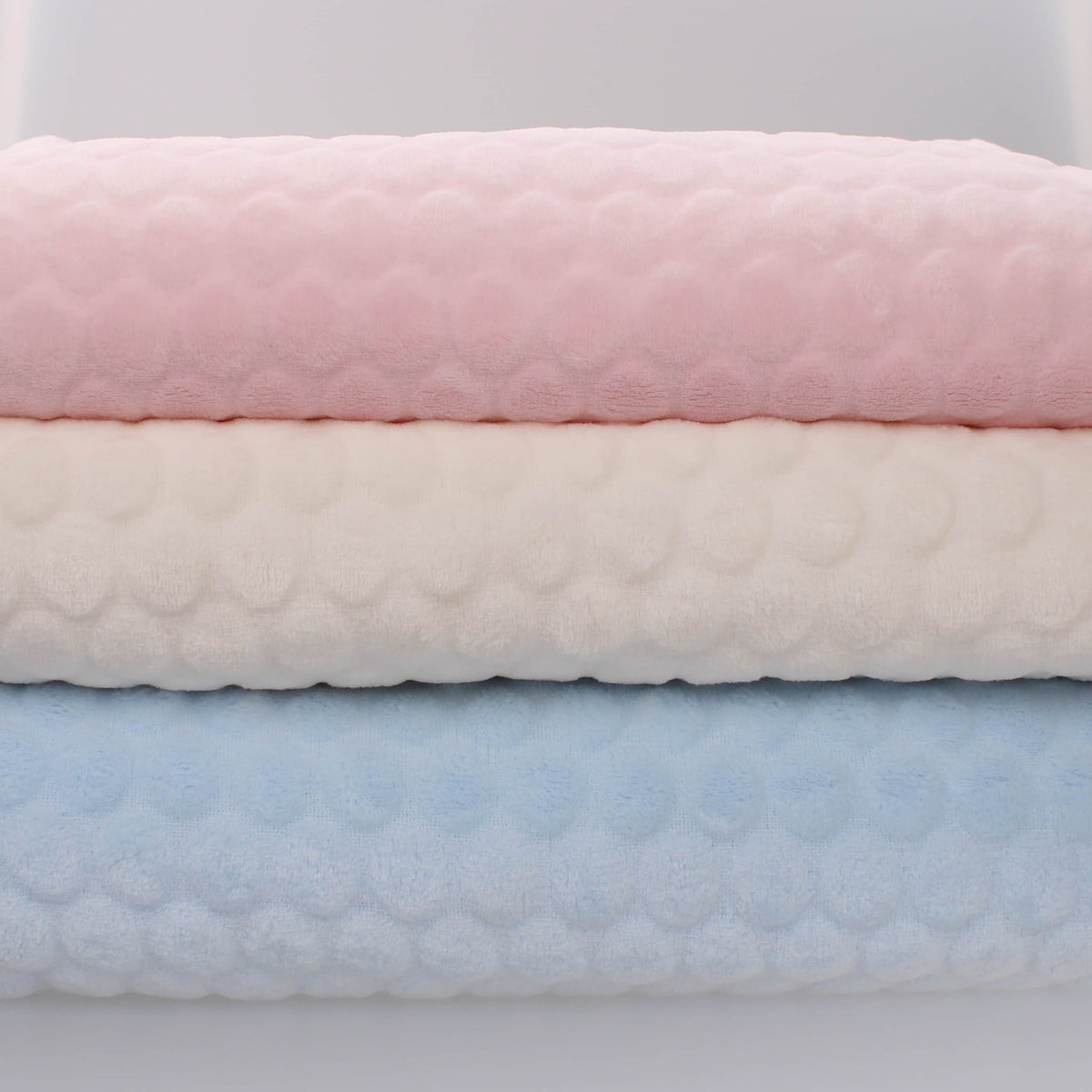 baby soft fleece in large dimple dots soft cream