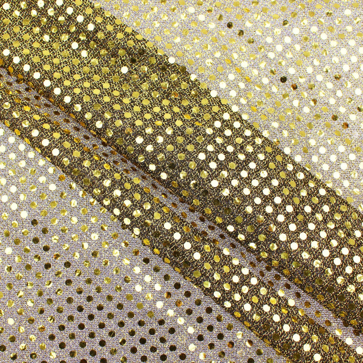 stuck on sequins on shinny see through backing fabric Gold on Black