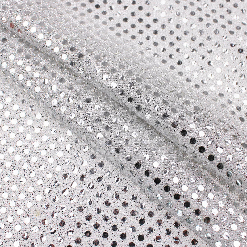 stuck on sequins on shinny see through backing fabric Silver