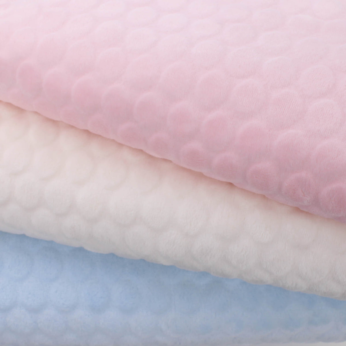baby soft fleece in large dimple dots soft cream